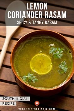 a brown bowl filled with green soup and garnished with cilantro leaves