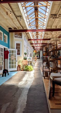 the inside of a building with lots of books on shelves