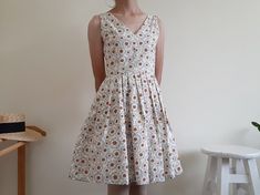 "Cream Floral Print Dress - Canvas fabric - Invisible nylon zipper on the back - Fixed waist - Fully lined - Pleated skirt - Ready to ship in 1-3 business days Measurements : Bust : 34\" Waist : 26\" Hips : free Total length : 35.5\" Shoulder to waist : 14.5\" Model height : 5'6\" bust : 33\" waist : 25\" hips : 35\" Please read the policies tab before purchase. I can't have a model for clothes of all sizes, but I have already clearly written a model size. If you have questions about the size, p Fitted A-line Cotton Sundress, Sleeveless Lined Cotton Dress, Cotton A-line Sundress Sleeveless, Sleeveless Cotton Lined Sundress, Fitted Cotton A-line Sundress, Cotton V-neck Lined Sundress, Fitted Cotton Sundress Lined, Fitted Cotton Sundress With Lining, White Lined Sleeveless Cotton Dress