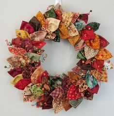 a wreath made out of fabric and ribbon