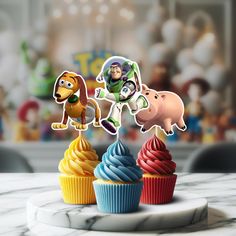 the toy story cupcakes are decorated with characters from pixama and woody