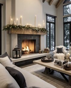 a living room filled with furniture and a fire place in the middle of a room