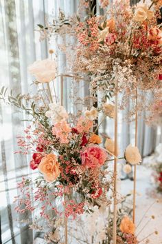 an arrangement of flowers on display in a room