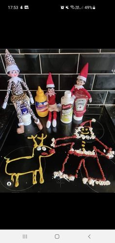 the elfs are making christmas cookies on the counter