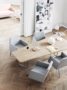 an overhead view of a dining table with chairs