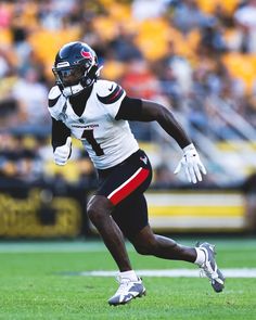 a football player is running on the field