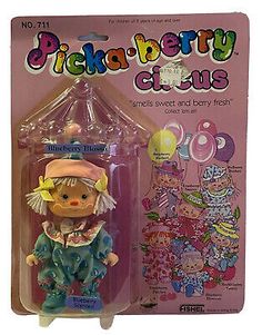 Designer : FISHEL TOYS. Item: BLUEBERRY BLOSSOM. Collection: PICKA-BERRY CIRCUS. Item is Preowned from Adult Collector and Never Opened. These dolls are HTF as well as information on them. Box Condition is based on a "C-SCALE GRADING SYSTEM". Blueberry Blossom, Clowncore Kidcore, Strawberry Shortcake Doll, Living Dead Dolls, Grading System, Clowning Around, Toy Doll, Doll Collection, Doll Play