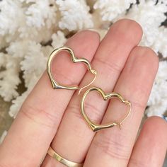 10KT yellow gold polished open heart hoop earrings in medium size. We carry 3 sizes of this style earring- this is the middle size. Measures: 22mm x 19mm Thickness: 3mm Hollow Finished on all sides Weight: .65g Valentine's Day Open Heart Huggie Earrings For Anniversary, Valentine's Day Open Heart Huggie Earrings, Heart-shaped Pierced Hoop Earrings For Anniversary, Gold Open Heart Huggie Earrings For Anniversary, Tarnish Resistant Heart Hoop Earrings For Anniversary, Yellow Gold Open Heart Huggie Earrings, Hypoallergenic Heart Hoop Earrings For Anniversary, Gold Open Heart Huggie Earrings For Everyday, Gold Hypoallergenic Open Heart Hoop Earrings