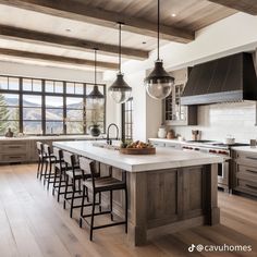 a large kitchen with an island and lots of counter space