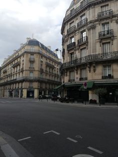 an empty city street with buildings on both sides