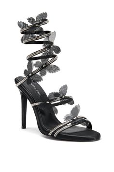 Step into elegance with the ARYANA-BLACK STILETTO SANDAL, designed with a luxurious Black stiletto and sleek open toe, adorned with bursts of twinkling crystal studded straps and a crystal wrap up cord with ethereal butterfly accents. The perfect heel for any special event or evening out! Quinceanera Shoes Heels, Sweet 16 Shoes, Ethereal Butterfly, Black Heels Prom, High Heels For Prom, Butterfly Heels, Crystal Wrap, Butterfly Applique, Tie Up Heels