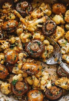 a pan filled with mushrooms and other vegetables