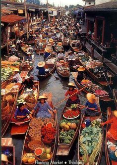 many boats filled with lots of food on the water