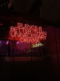 a neon sign on the side of a building that says science is better than necessary drama