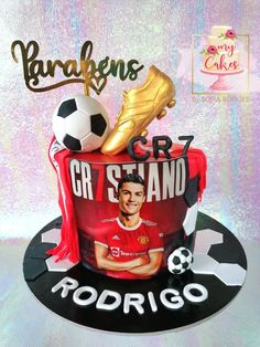 a birthday cake with a soccer theme on the top and an image of cristianoo