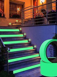 the stairs are lit up with green lights