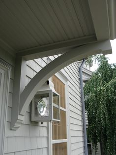 an outdoor light on the side of a house