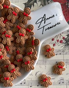 some cookies that are on a plate with music notes in front of them and the words annie treaue