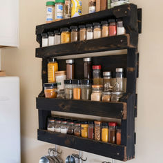 an organized spice rack in the kitchen