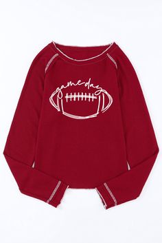 a red sweater with a football on it