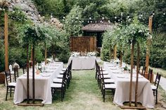 an outdoor wedding setup with tables and chairs