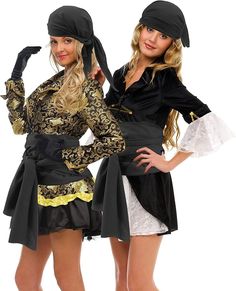 two beautiful women dressed in costumes posing for the camera with their hands on their hips