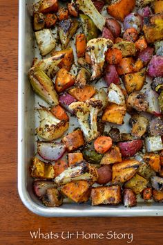 roasted vegetables in a baking dish on a wooden table with the words what's cr home story written below