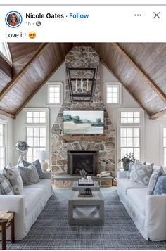 a living room filled with furniture and a fire place in the middle of a room