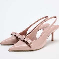 Slingback Heels With Faux Patent Leather Finish.Bow Detail At Front. Pointed Toe. Back Strap With Elastic Heel Height: 2.4inches (6cm) Pink : 2265 /310 Upper 100% Polyurethane Lining 100% Polyurethane Sole 100% Polyurethane Thermoplastic Insole 100% Polyurethane Zara Evening Slingback Pumps For Spring, Zara Slingback Pumps For Spring, Feminine High Heel Slingback Pumps With Bow Straps, Elegant Zara Slingback Pumps With Open Heel, Elegant Zara Slingback Pumps For Spring, Feminine Spring Slingback Pumps, Zara Open Heel Slingback Pumps For Spring, Spring Zara Slingback Pumps With Heel Strap, Feminine High Heel Slingback Pumps