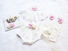 "WHITE BOHO SASH ROMPER Elegant super soft ruffled eyelet shoulder romper embellished with beautiful double sided highest quality ribbon sash adorned with chiffon flower with jewels and pearls. {use} *Birthday, *Baptism, *Easter, *special occasions, *picture props, *weddings, *for fun! Available dress sizes below: 0-6 months 6-12 months 12-24 months 2T CHOICE OF HEADBANDS-- #1 #2 #3 Beautiful matching headbands adorned with jeweled flower and can be also made on hard headband or alligator clip. Cream Bubble Romper With Ruffles For Baptism, Cream Ruffled Bubble Romper For Baptism, Cream Bubble Romper For First Birthday In Spring, White Bubble Romper For Baptism And Spring, White Bubble Romper For Baptism In Spring, White Fitted Bubble Romper For Baptism, Cute White Bubble Romper For First Birthday, White Cute Bubble Romper For First Birthday, White Bubble Romper For First Birthday