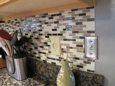 the kitchen counter is clean and ready to be used as a utensil holder