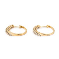 Gender: Ladies    Metal Type: 14K Yellow Gold    Length: 0.75 Inches    Width: 20.90 mm    Weight: 3.63 grams    Ladies 14K yellow gold diamond hoop earrings with locking backs. Engraved with "14K".    Pre-owned in excellent condition. Might shows minor signs of wear.    Shared-Prong Set in 14 Karat Yellow Gold with:    Twenty-four (24) round brilliant cut natural diamonds:    Measurements: 1.70mm - 1.80mm in diameter x ~1.07mm in depth.  Weight Range: 0.020 ct. - 0.023 ct.  Estimated Total Weight: 0.530 ct.  Color: L - M  Clarity: I1 - I2  Cut: Good  Polish: Good  Symmetry: Good  TOTAL WEIGHTS:    Total weight of diamond(s):~0.53 ctw.  Please reference the dimensions noted in the description above for the most accurate measuremens. Yellow Gold Hoop Earrings With Brilliant Cut For Anniversary, Gold Round Channel Set Diamond Earrings, Gold Round Diamond Earrings Channel Set, Yellow Gold Hoop Diamond Earrings With Prong Setting, Yellow Gold Round Cut Hoop Earrings For Anniversary, Timeless Hoop Diamond Earrings For Anniversary, 14k Gold Hoop Earrings With Diamond Accents, Anniversary Yellow Gold Hoop Earrings With Diamond Accents, Classic Gold Channel Set Hoop Earrings