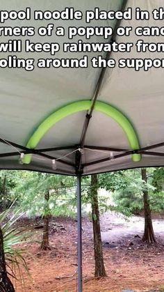 the inside of a tent with trees in the background