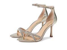 a pair of women's silver high heeled sandals with ankle strap and open toe