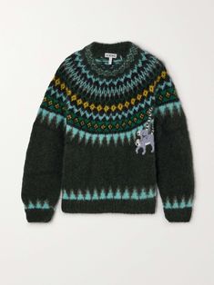 a green sweater with an elephant on the front and yellow, blue, and green stripes