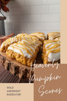 there are several pumpkin scones with icing on the top and one is cut in half