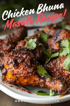 chicken bhuna masala recipe on a white plate with cilantro garnish