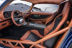 the interior of a sports car with leather trims and steering wheel, dashboard, and dash board