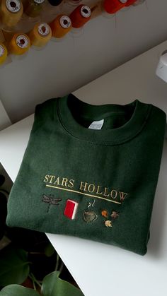 Gilmore Girls Stars Hollow Connecticut Embroidered Sweatshirt with Coffee and Books Gilmore Girls Stars Hollow Connecticut Embroidered Sweatshirt with Coffee and Books, Gilmore Girls, Rory Gilmore, Fall Sweatshirt, Cozy Fall sweatshirt, Gilmore Girls Merch, Gilmore Girls inspired sweatshirt Stars Hollow Sweatshirt, Gilmore Girls Stuff, Gilmore Girls Clothes, Gilmore Girls Merch, Fall Merch, Gilmore Girls Sweater, Gilmore Girls Stars Hollow, Fall Gilmore, Gilmore Girls Sweatshirt