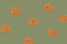 an orange pumpkin pattern on a green background