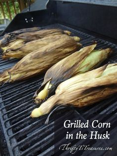 grilled corn in the husk on an outdoor grill