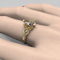 a woman's hand with a fancy ring on it