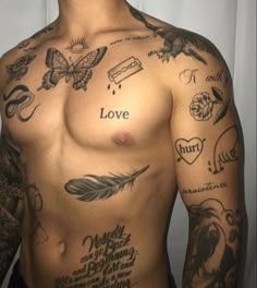 a shirtless man with tattoos on his chest and arm, has the word love written in many different languages