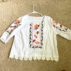 White, Embroidered Peasant Blouse, Never Worn. Pit-Pit 20”, Length From Shoulder 21”, Sleeve From Shoulder 13”. Peasant Style Embroidered Top For Vacation, Spring Folk Tunic Peasant Top, Spring Folk Style Peasant Tunic Top, Spring Folk Peasant Tunic Top, White Cotton Peasant Top With Embroidered Sleeves, White Bohemian Peasant Top With Embroidered Sleeves, Spring Peasant Top With Multicolor Embroidered Neckline, Bohemian White Peasant Top With Embroidered Sleeves, White Floral Print Tunic Top