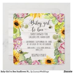 the baby girl to be shower card is shown with flowers and bees on white wood