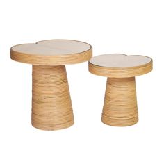 two tables made out of bamboo with white tops