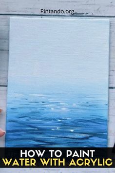 someone holding up a painting with the words how to paint water with acrylic