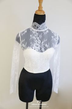 a mannequin wearing a white and black top