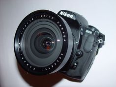 a close up of a camera with its lens pointed at the camera's body