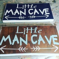 two wooden signs that say little man cave and little man cave with arrows on them